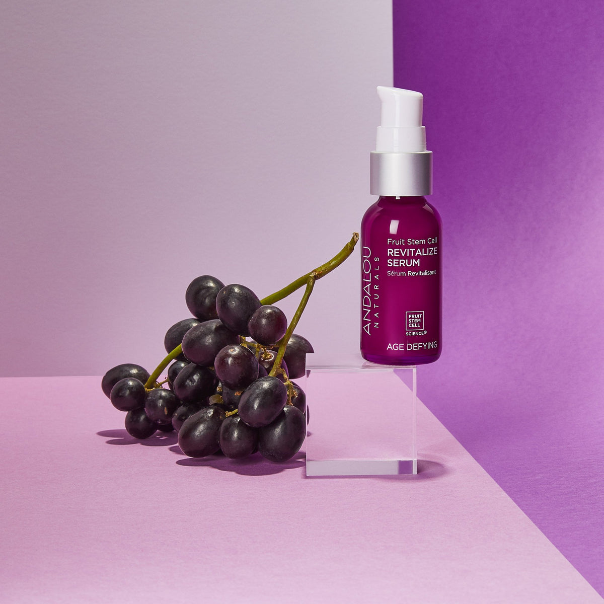Age Defying Fruit Stem Cell Revitalize Serum bottle with concord grapes